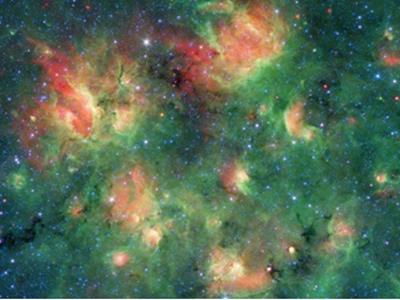 تلسکوپ فضایی اسپیتزر منطقه ای پرستاره با حبابهای در حال انفجار را رصد کرد